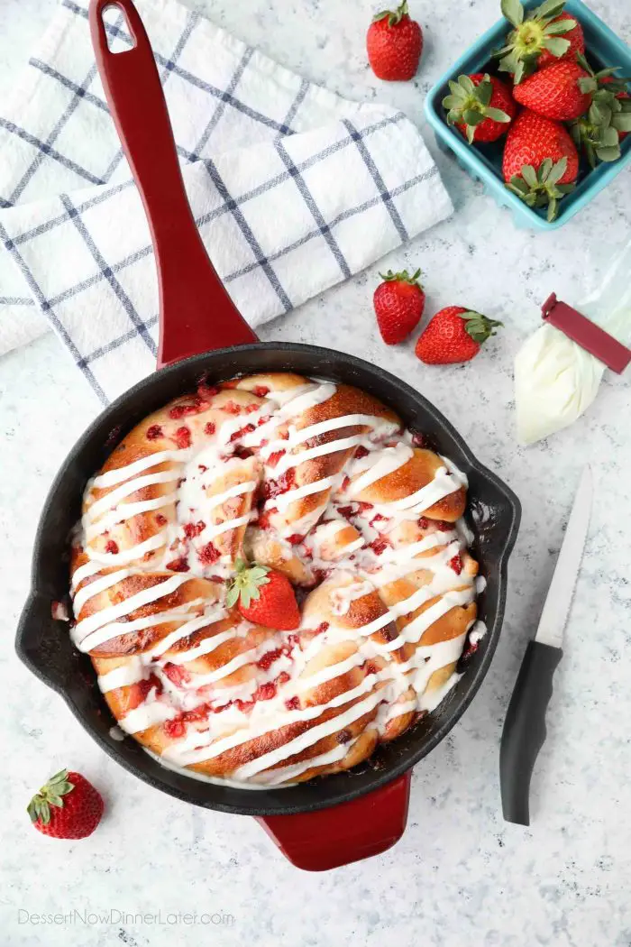 Strawberry Swirl Bread is a twist on classic sweet rolls. Sweet strawberry preserves and chunks of fresh strawberries are twisted inside of soft yeast bread, then baked until golden. Top it with a creamy icing and this easy sweet bread is perfect for breakfast or dessert.