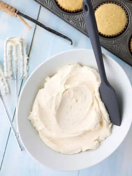 This Vanilla Buttercream Frosting recipe is easy, creamy, and extremely versatile. Made with basic ingredients, this vanilla frosting is a staple for decorating cakes, cupcakes, or cookies.