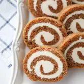 This Carrot Cake Roll is a classic Easter dessert with a twist. Spiced carrot cake is rolled up with the best cream cheese frosting inside. It's beautiful, delicious, and easy to make.