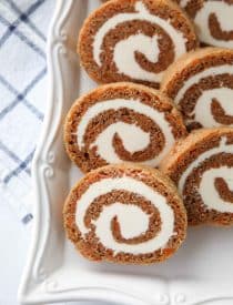 This Carrot Cake Roll is a classic Easter dessert with a twist. Spiced carrot cake is rolled up with the best cream cheese frosting inside. It's beautiful, delicious, and easy to make.