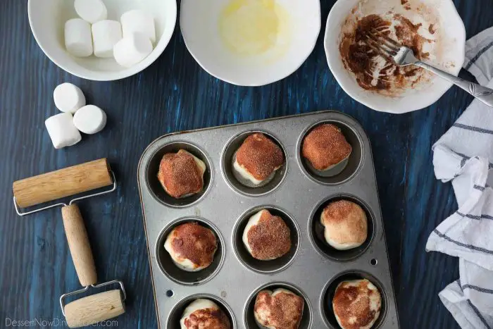Place prepared resurrection rolls into a greased muffin tin.
