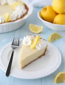 Lemon Cream Pie is tangy and sweet with a buttery graham cracker crust. It's just like key lime pie, but made with lemons, and topped with fresh sweetened whipped cream. A super easy spring or summer dessert, and great alternative to lemon meringue pie.