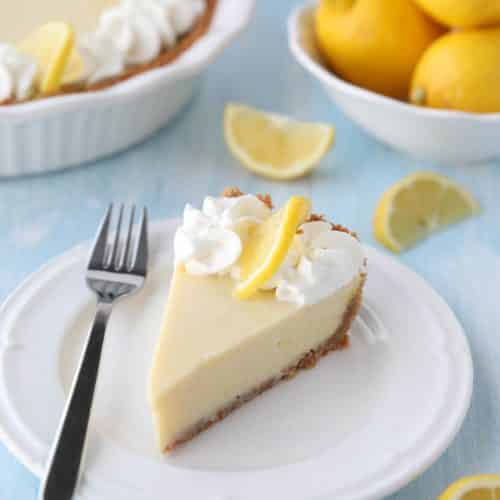 Lemon Cream Pie is tangy and sweet with a buttery graham cracker crust. It's just like key lime pie, but made with lemons, and topped with fresh sweetened whipped cream. A super easy spring or summer dessert, and great alternative to lemon meringue pie.