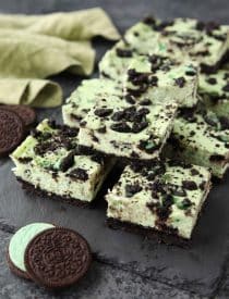 Mint Oreo Cheesecake Bars - a dessert for the mint chocolate lovers. With a mint Oreo crust, and a cool and creamy mint cheesecake loaded with extra chunks of mint Oreos throughout.