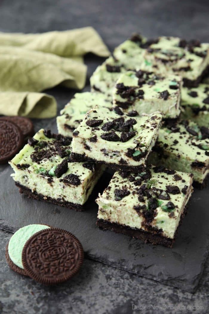 Mint Oreo Cheesecake Bars - a dessert for the mint chocolate lovers. With a mint Oreo crust, and a cool and creamy mint cheesecake loaded with extra chunks of mint Oreos throughout.