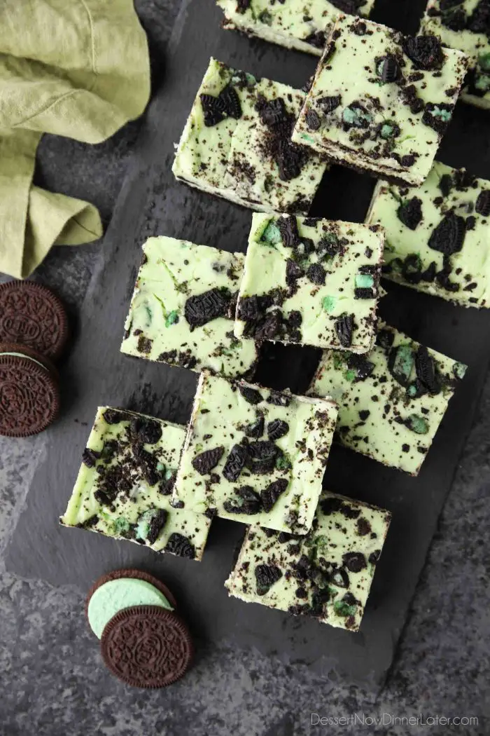 Mint Oreo Cheesecake Bars - a dessert for the mint chocolate lovers. With a mint Oreo crust, and a cool and creamy mint cheesecake loaded with extra chunks of mint Oreos throughout.