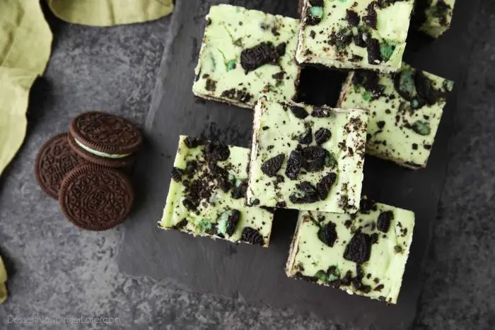 Mint Oreo Cheesecake Bars - a dessert for the mint chocolate lovers. With a mint Oreo crust, and a cool and creamy mint cheesecake loaded with extra chunks of mint Oreos throughout.