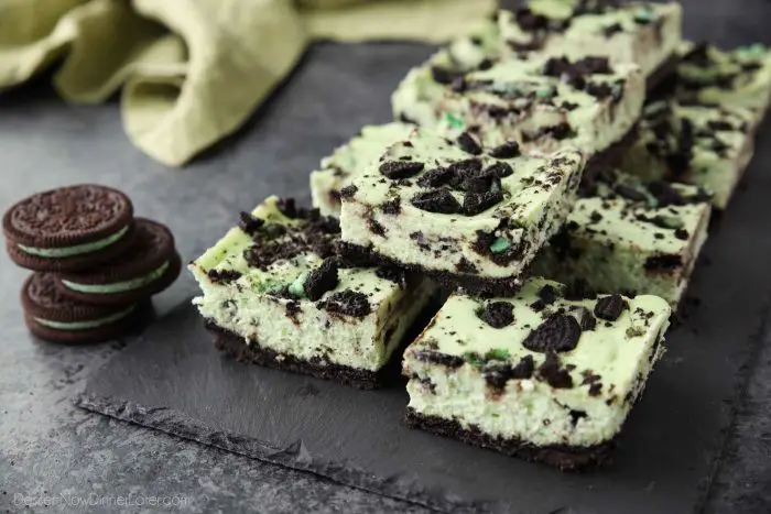 Mint Oreo Cheesecake Bars - a dessert for the mint chocolate lovers. With a mint Oreo crust, and a cool and creamy mint cheesecake loaded with extra chunks of mint Oreos throughout.