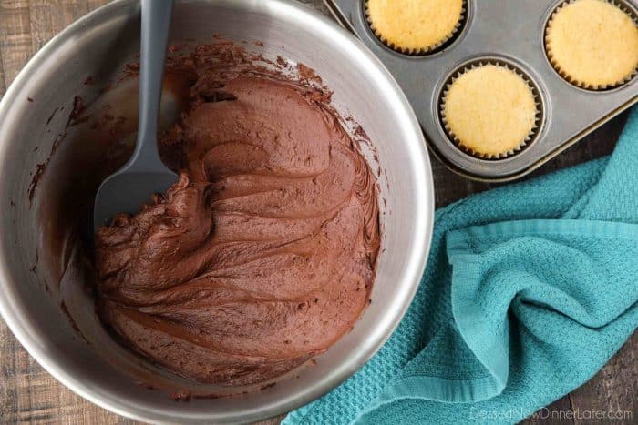 Bowl of creamy homemade chocolate buttercream frosting.