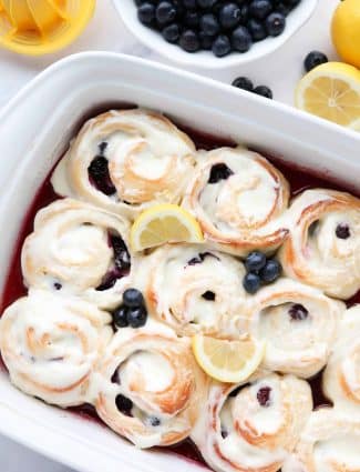 Lemon Blueberry Sweet Rolls are made easy with store-bought bread dough, a sticky lemon filling, fresh blueberries, and a tangy lemon cream cheese frosting.