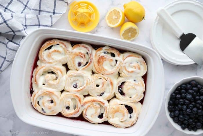 Freshly baked lemon blueberry sweet rolls covered in lemon cream cheese frosting. Ready to eat!