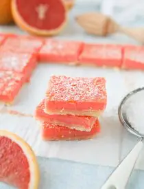Grapefruit Bars are just like your favorite lemon bars with a shortbread crust and citrus curd, but with the sweeter flavor of pink grapefruit.