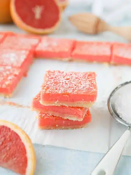 Grapefruit Bars are just like your favorite lemon bars with a shortbread crust and citrus curd, but with the sweeter flavor of pink grapefruit.