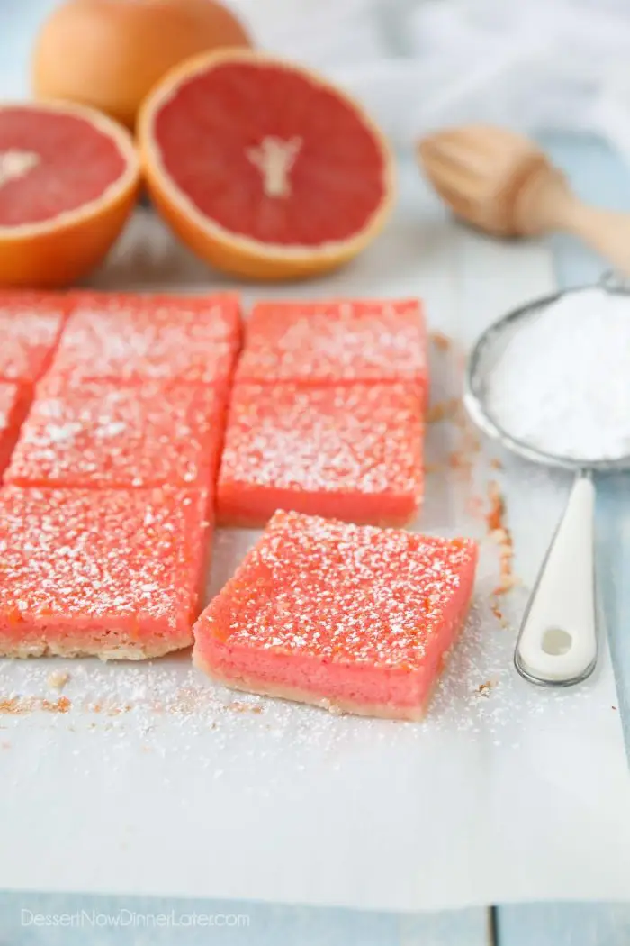 Grapefruit bars (just like lemon bars) cut into squares with a dusting of powdered sugar on top.