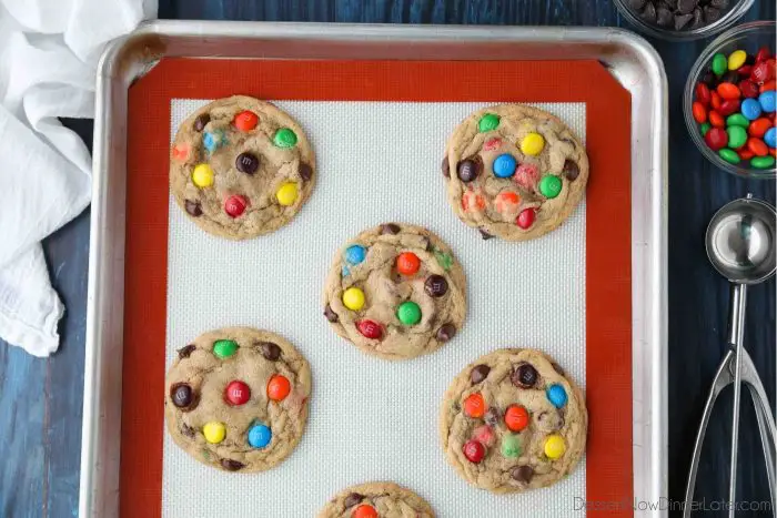 Freshly baked Chocolate Chip M&M Cookies on a sheet tray.