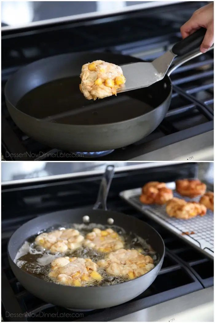 Frying peach fritters in a pan of hot oil.