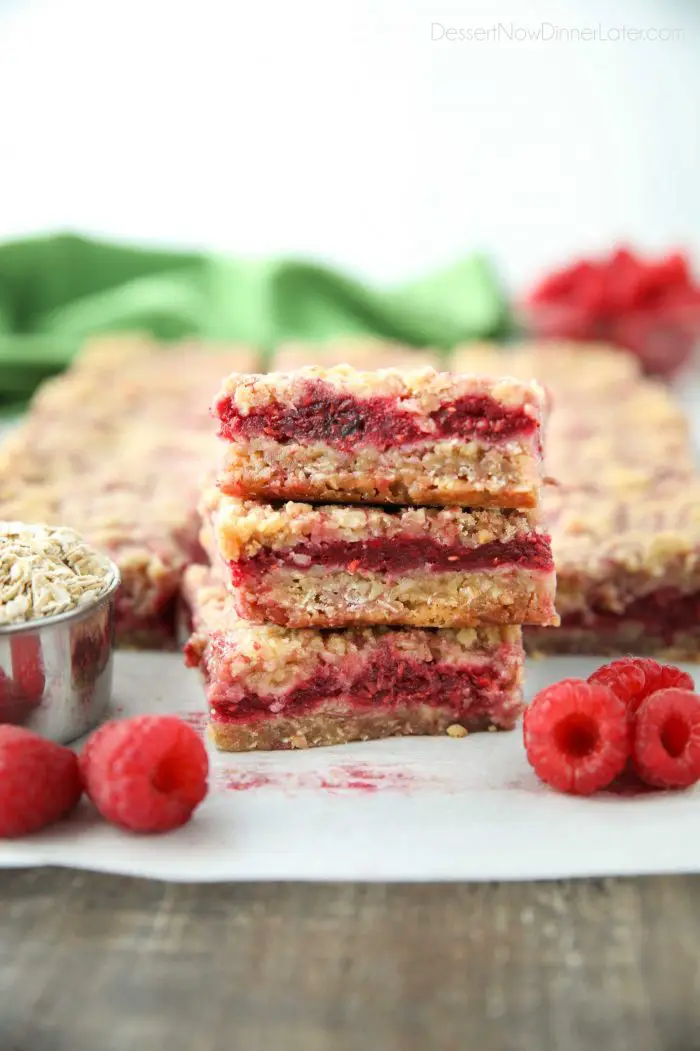 Three Raspberry Crumble Bars stacked on top of each other.