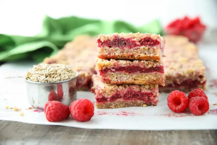 Three Raspberry Crumble Bars stacked on top of each other.
