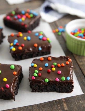 These homemade cosmic brownies are even better than store-bought! Rich, fudgy brownies are topped with a creamy chocolate ganache and candy coated chocolate chips. They're easy to make from scratch and not just for lunchbox treats!