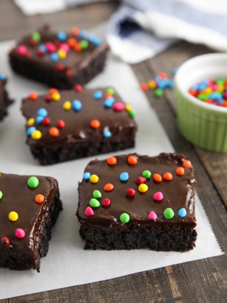 These homemade cosmic brownies are even better than store-bought! Rich, fudgy brownies are topped with a creamy chocolate ganache and candy coated chocolate chips. They're easy to make from scratch and not just for lunchbox treats!