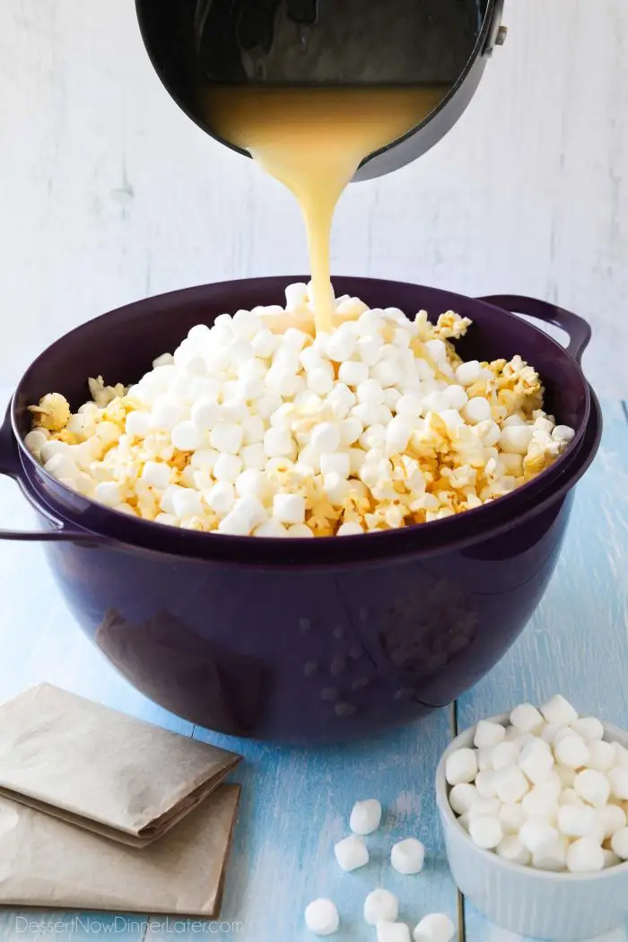 Pouring the hot buttery syrup mixture over the popcorn will melt the mini marshmallows to create a soft and gooey marshmallow popcorn treat.