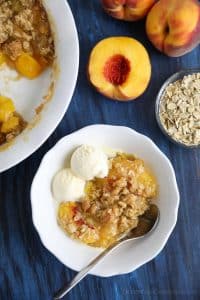 This easy peach crisp recipe (aka peach crumble) is loaded with fresh, juicy peaches topped with a generous helping of buttery brown sugar and oat streusel. Enjoy it with warm with a scoop of vanilla ice cream.