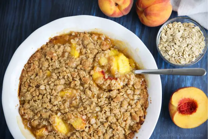 Peach Crisp (aka Peach Crumble) has saucy peaches and a crunchy streusel topping.