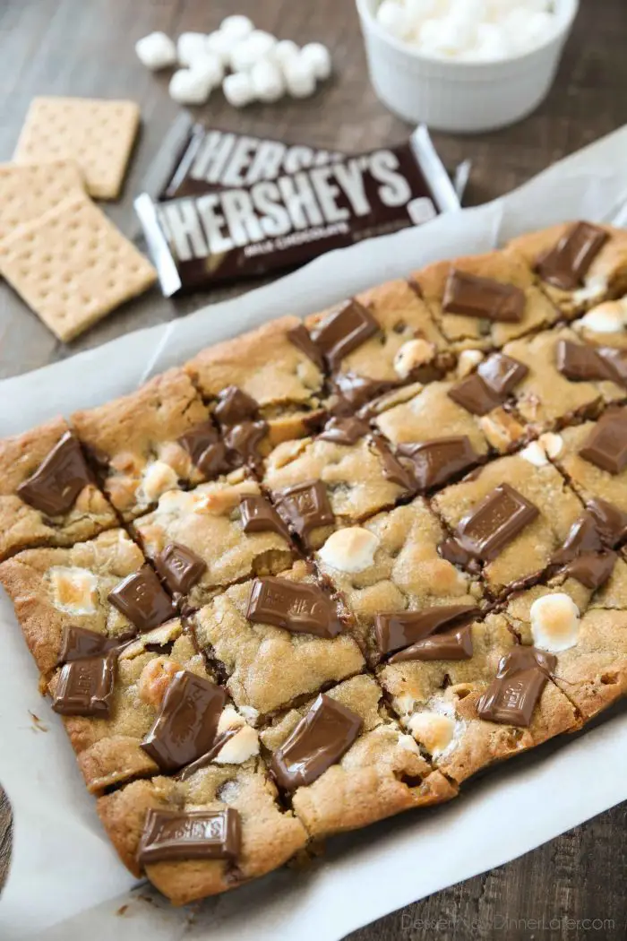 Chocolate chip cookie dough combines with a graham cracker crust, mini marshmallows, and chocolate pieces to make S'mores Cookie Bars.