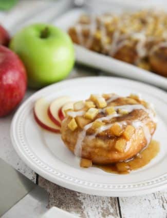 Caramel Apple Cinnamon Rolls are a twist on caramel pecan rolls, with fresh apples instead of nuts. They’re made easy with frozen cinnamon rolls so half the work is done for you! A great breakfast or dessert in the Fall, on holidays, or the weekend.