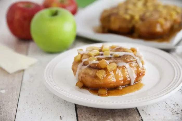 Sticky caramel apple cinnamon rolls are semi-homemade and 100% delicious. With fresh apples, and a quick caramel sauce baked in the oven.