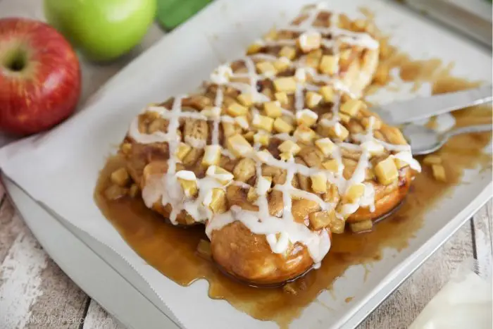 Turn frozen cinnamon rolls into a these easy caramel apple rolls with fresh apples and an easy caramel sauce like sticky buns.