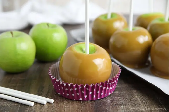 Classic homemade caramel apples are fun to make from scratch. Any leftover caramel can be cooled, cut, and wrapped for treats.