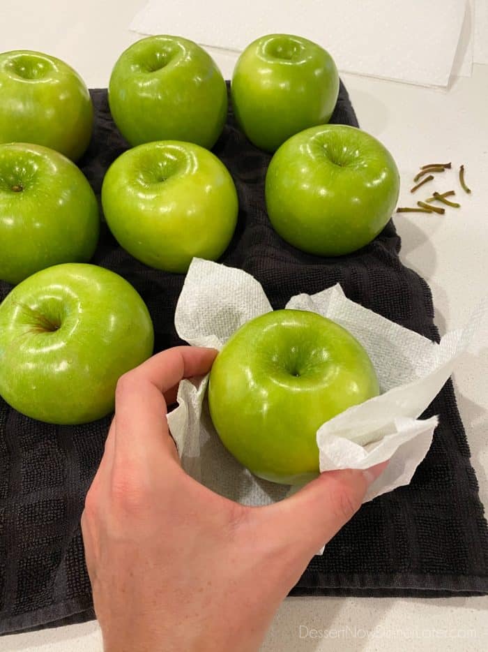 For caramel apples: Wash, rinse, and dry the apples completely. Remove stems before adding handles.