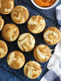 Pumpkin cream cheese muffins are light, fluffy, and moist, full of pumpkin spice flavor, and swirled with creamy cheesecake.