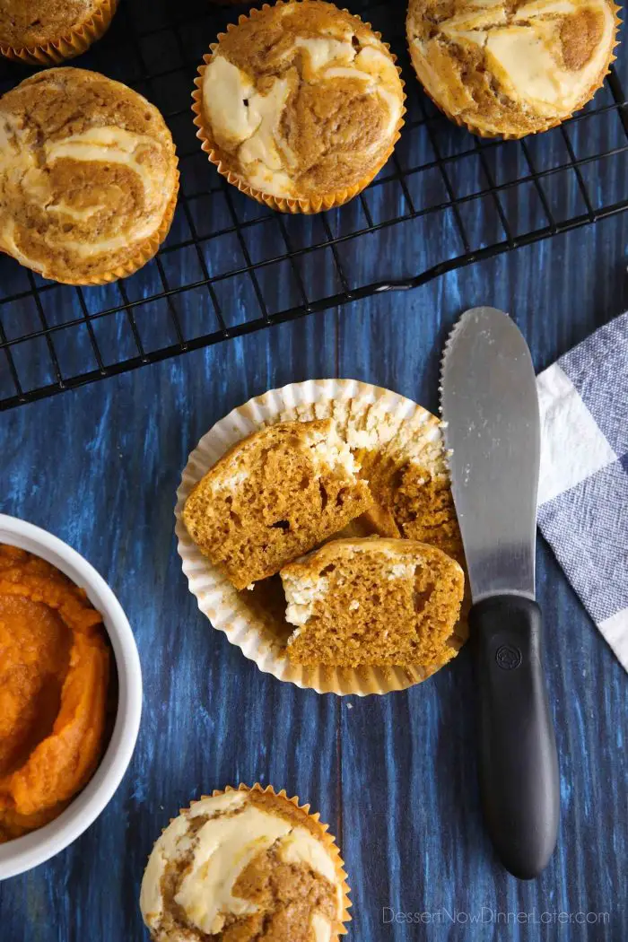 Pumpkin Cream Cheese Muffins are full of fall spices and a dollop of cream cheese filling swirled on top.