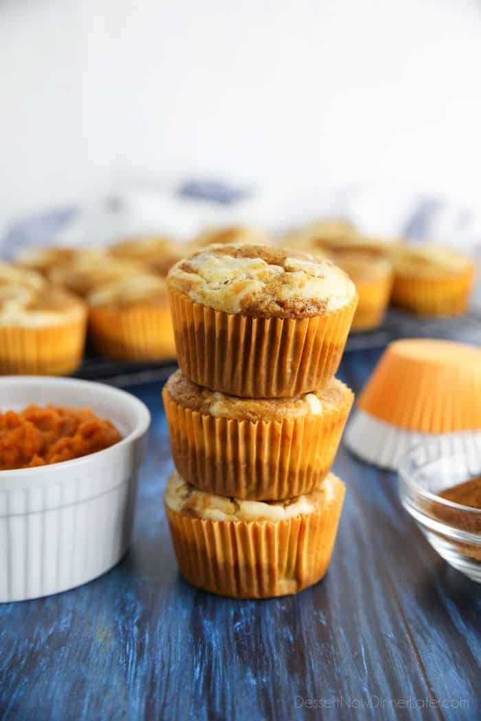 Spiced pumpkin muffins with swirls of cream cheese filling.