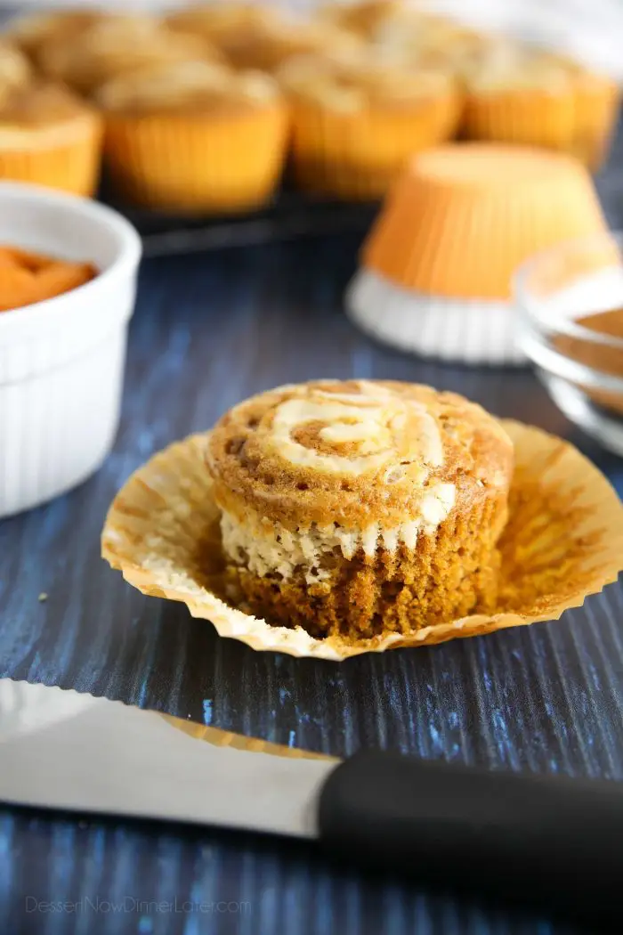 Moist pumpkin spiced muffins with a creamy cheesecake swirl on top.