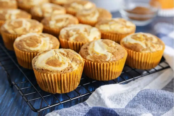 Pumpkin cream cheese muffins are light, fluffy, and moist, full of pumpkin spice flavor, and swirled with creamy cheesecake.