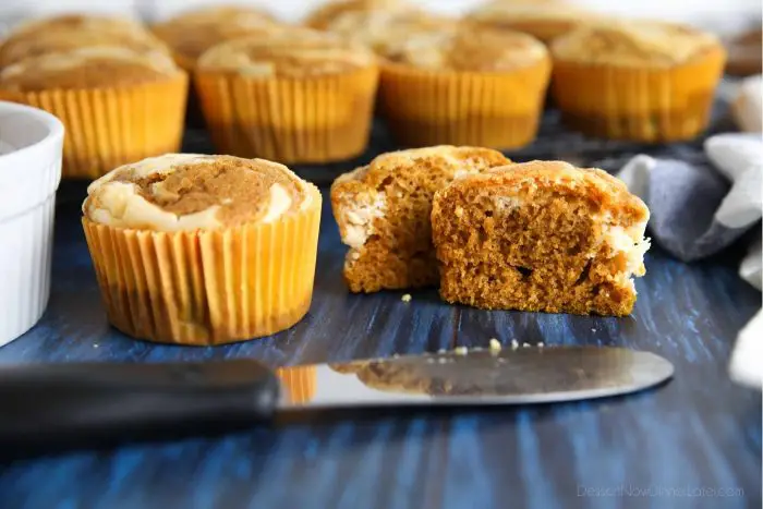 Fluffy and moist pumpkin spice muffins with cream cheese swirls.