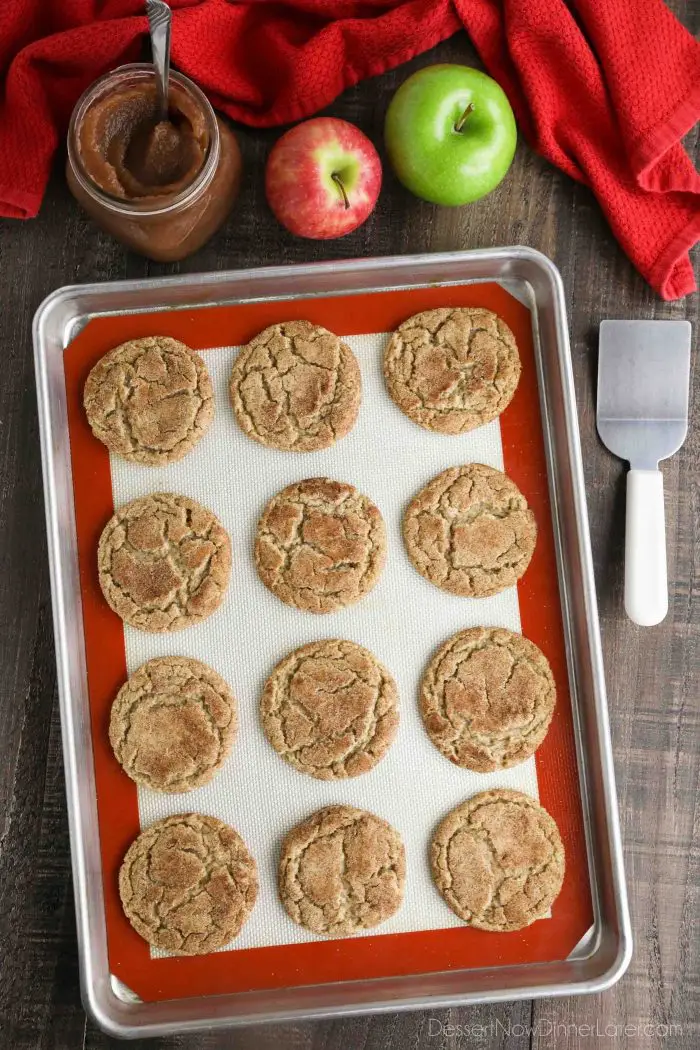 Top view of baked apple butter cookies on a cookie sheet.