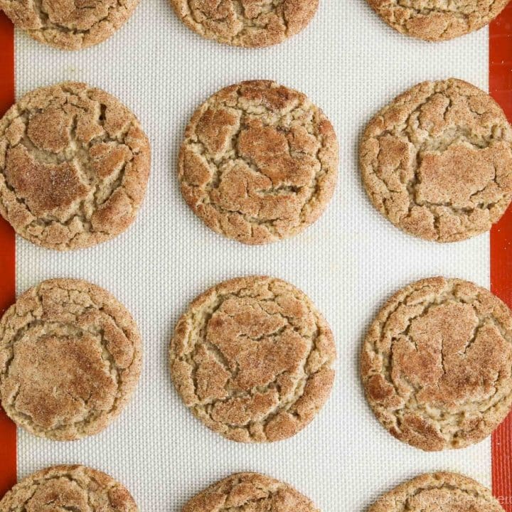 Top view of baked apple butter cookies on a cookie sheet.