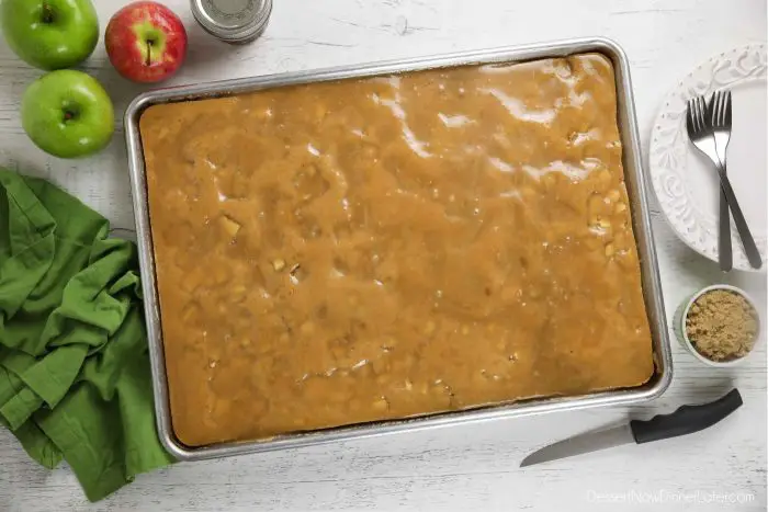 Freshly glazed apple sheet cake in a pan.