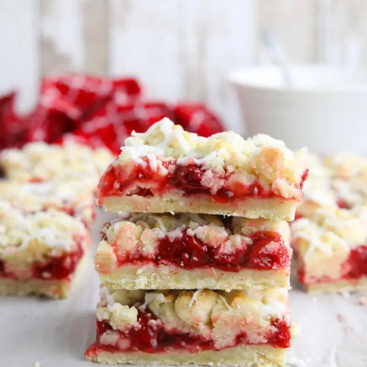 Three cherry pie bars stacked on top of each other.