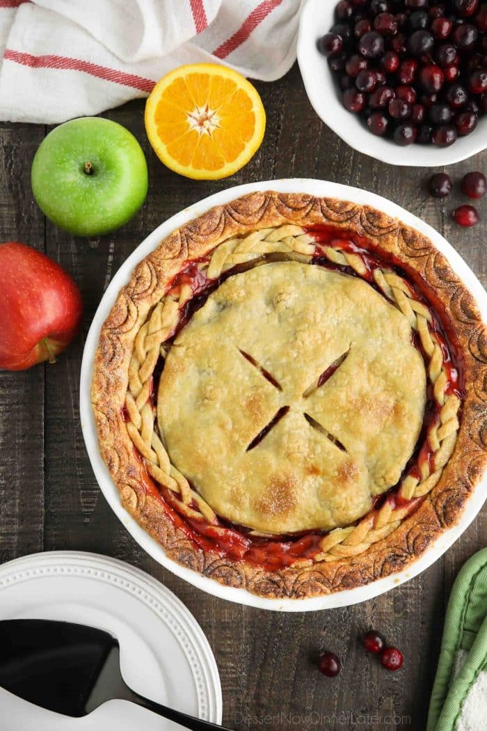 A whole apple cranberry pie with braided crust.