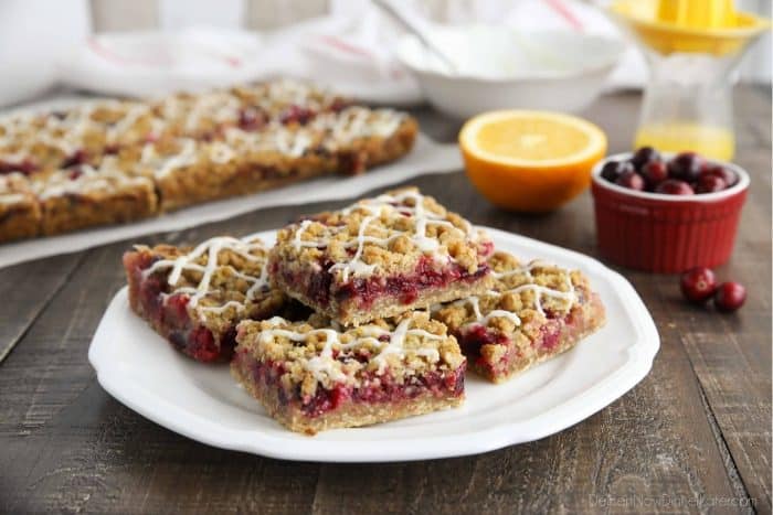 Plate of glazed cranberry crumb bars.