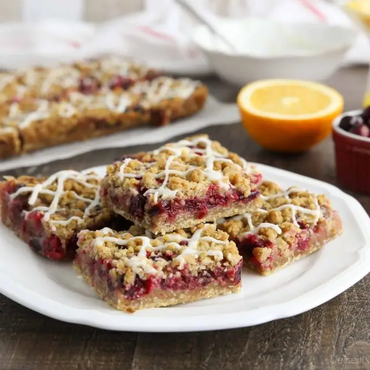 Plate of glazed cranberry crumb bars.