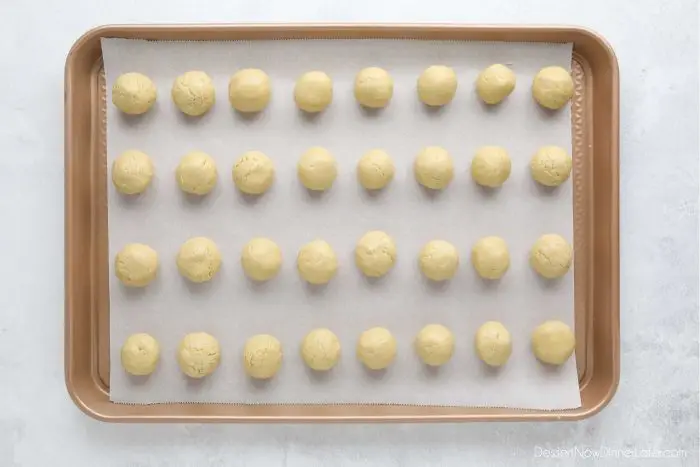 Peanut Butter Balls shaped on a tray, ready to be dipped in chocolate.