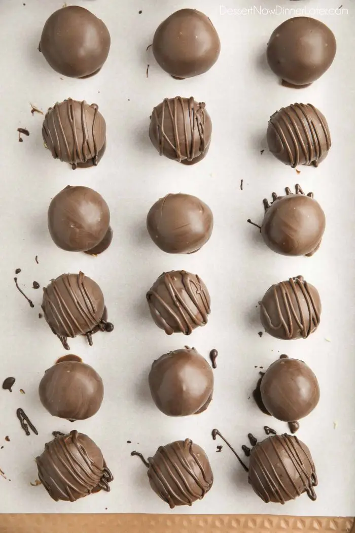 Chocolate dipped peanut butter balls. Some plain, and some drizzled with chocolate on top.