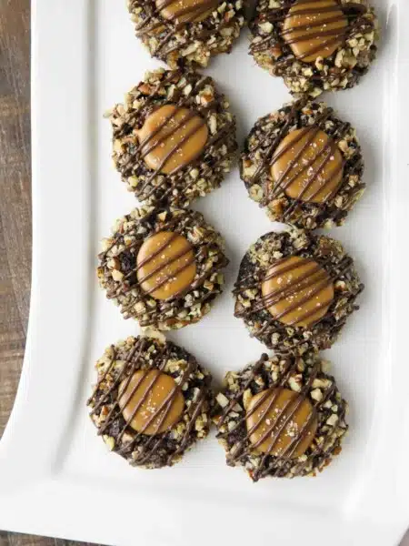 Turtle Thumbprint Cookies on long white rectangle platter.