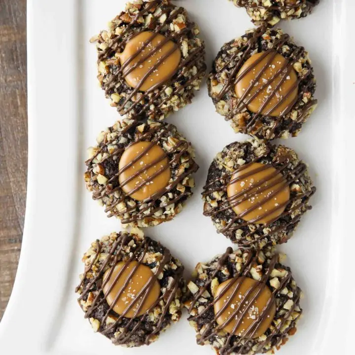 Turtle Thumbprint Cookies on long white rectangle platter.